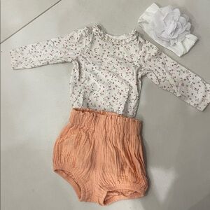 A cute onesie and sweat pants outfit